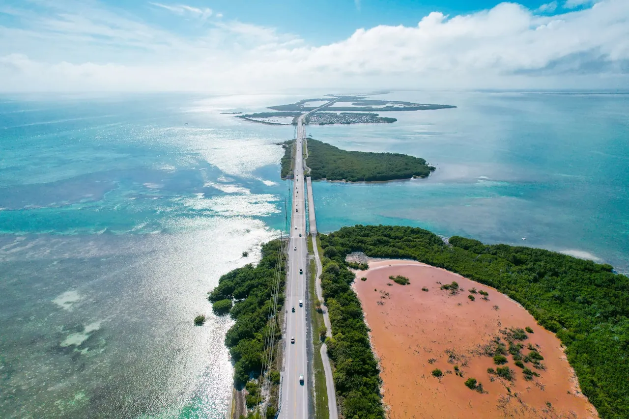 Aerial view of the Florida Keys island chain linked by a long bridge over turquoise water