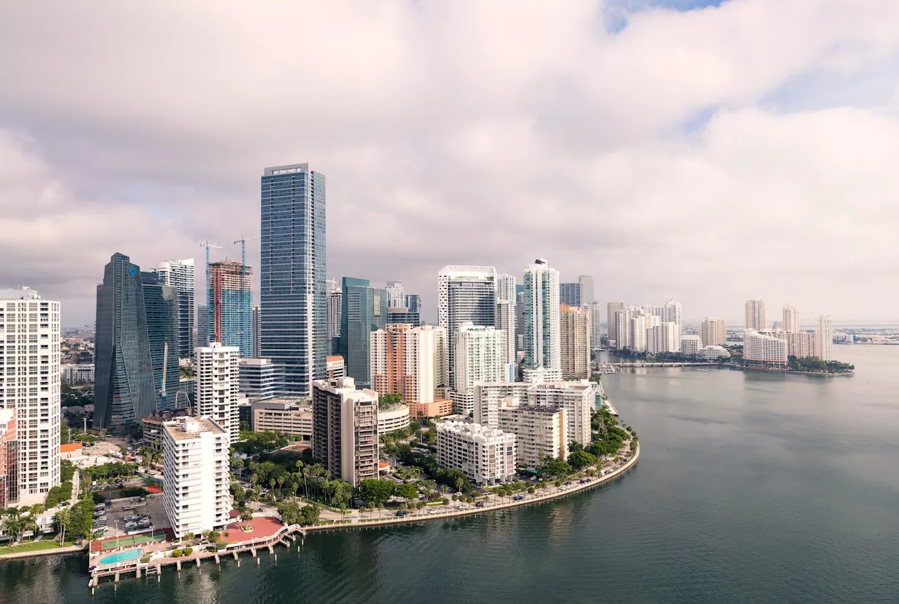 Downtown Miami skyline of glass high-rise towers reflected in the bay