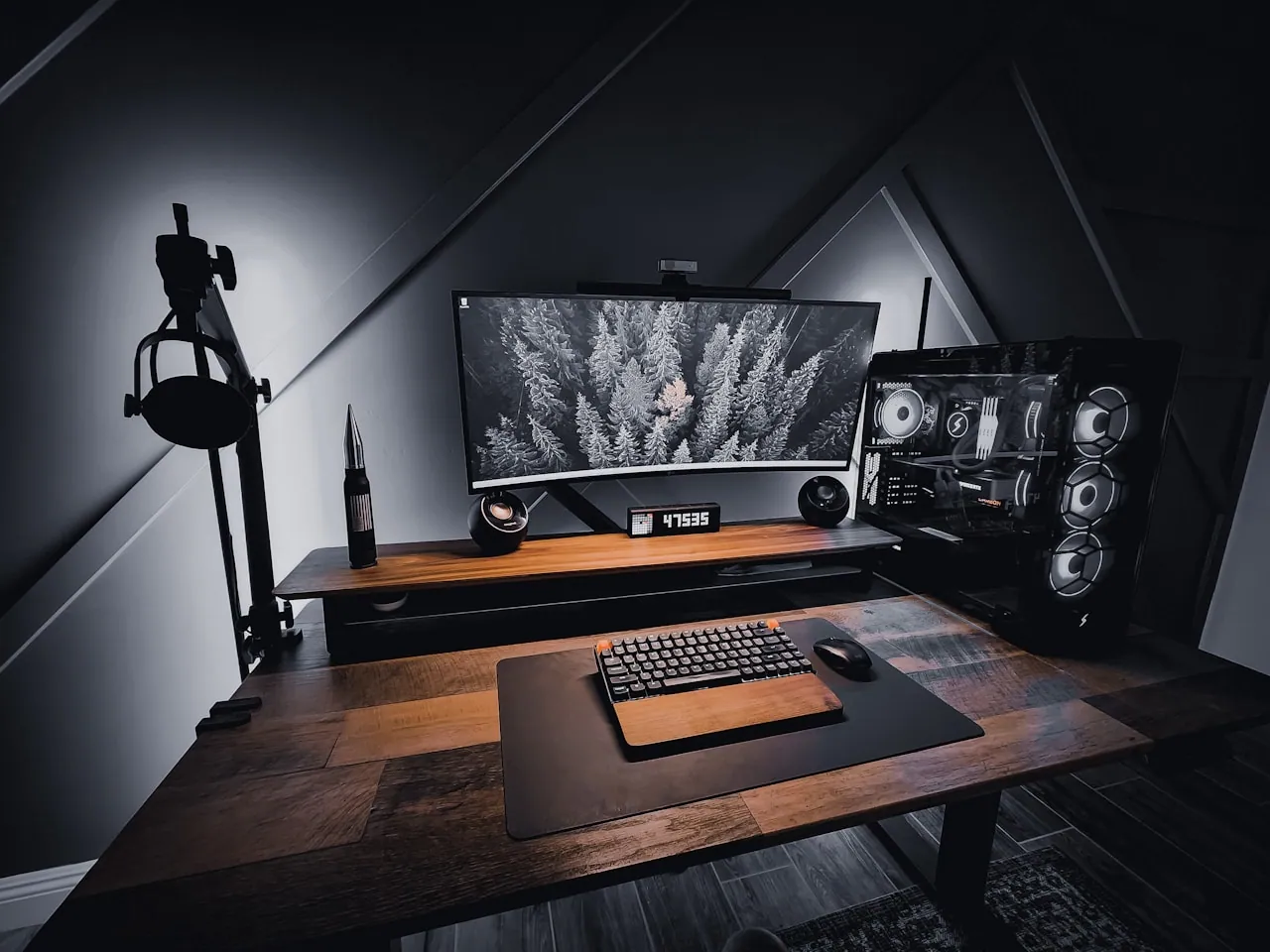 Gaming console next to an NVMe SSD and a storage expansion card on a desk